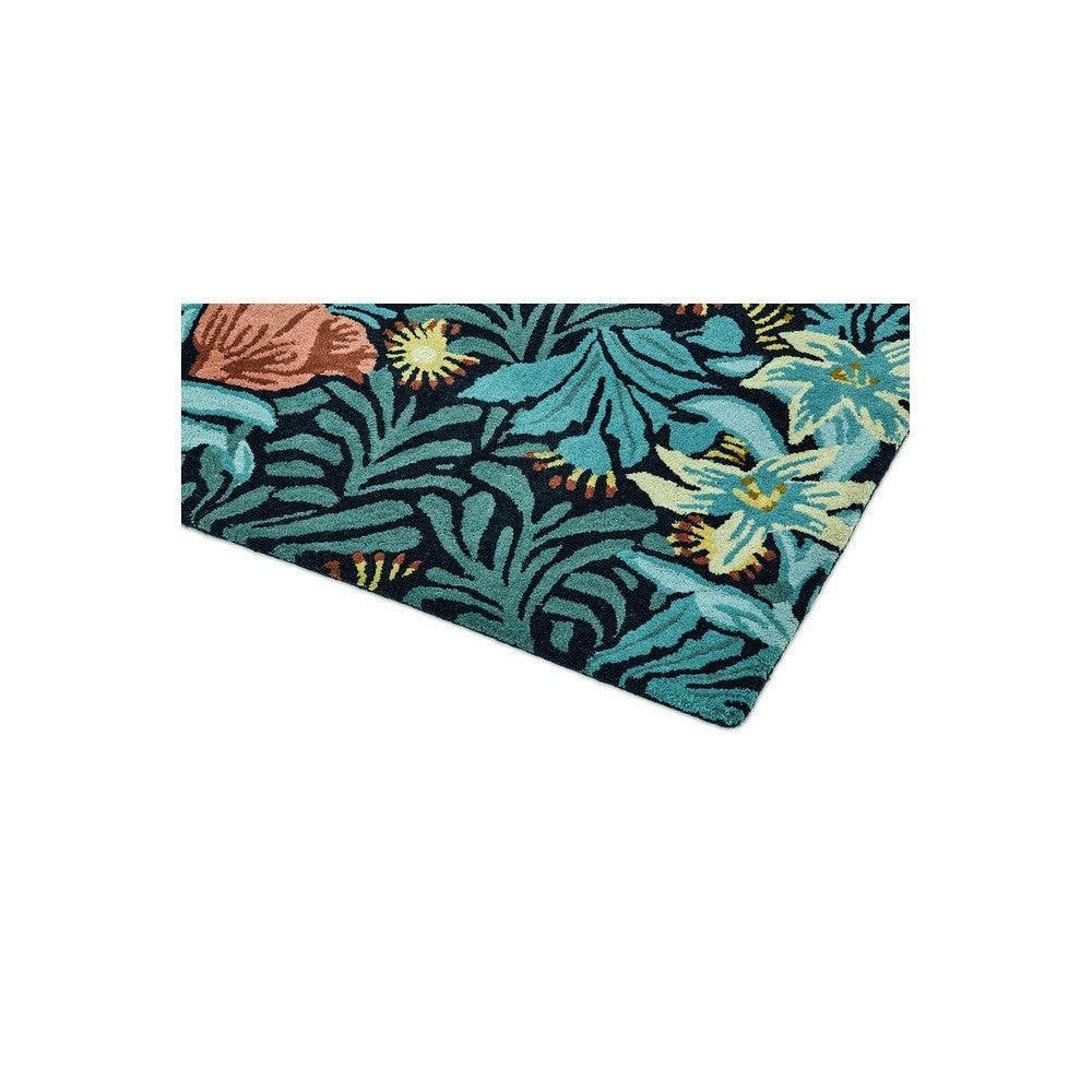 Morris & Co Bower Indigo Rug featuring botanical leaf pattern in teal, turquoise, navy and yellow on indigo, hand-tufted wool