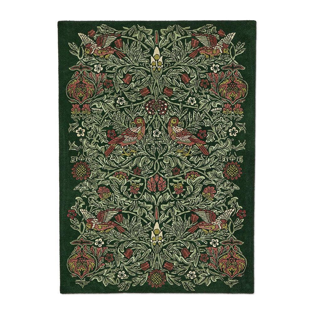 Morris & Co Bird Tump Green Rug featuring botanical birds in emerald, olive, burgundy on dark green, hand-tufted wool