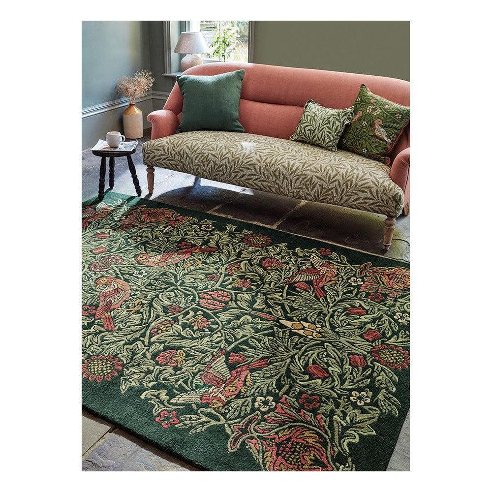 Morris & Co Bird Tump Green Designer Rug featuring botanical floral pattern with birds in emerald green, cream and red on deep green, hand-tufted wool