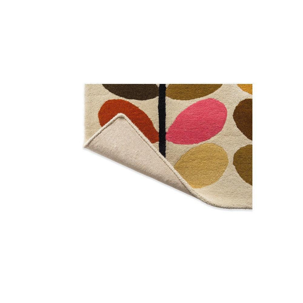 Orla Kiely Multi Stem Autumn Rug featuring stem pattern in pink, mustard, olive, brown and black on cream background, hand-tufted wool