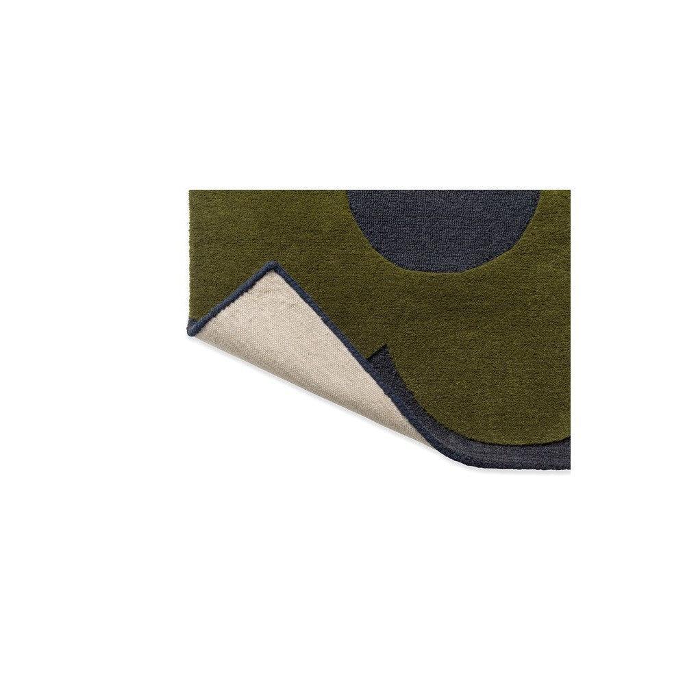 Orla Kiely Sprig Stem Marine rug featuring circular motif in olive green, navy and cream on dark navy border, hand-tufted wool