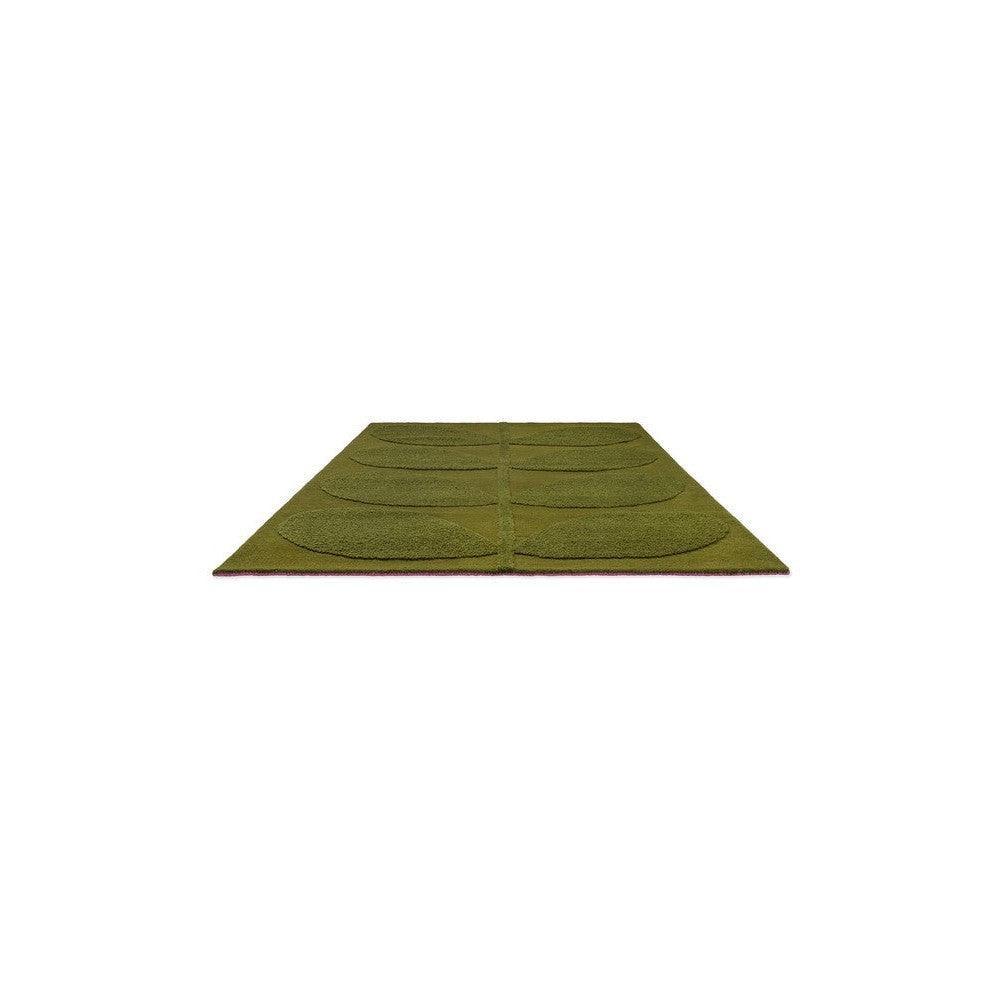 Orla Kiely Solid Stem Fern Rug featuring botanical stem fern pattern in olive green, sage green, forest green on pink backing, hand-tufted wool