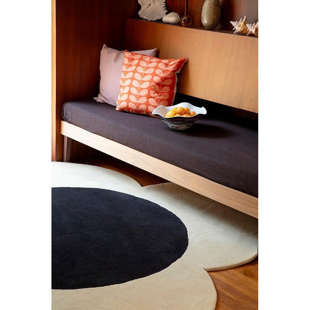 Orla Kiely Flower Spot rug featuring circular black spots on ecru cream background, Brink & Campman 2024 collection