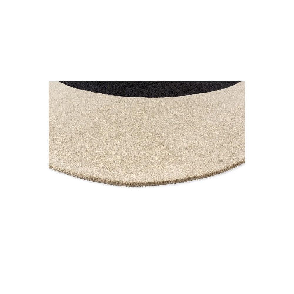 Orla Kiely Flower Spot rug featuring curved abstract motif in ecru and black on beige background, hand-tufted wool