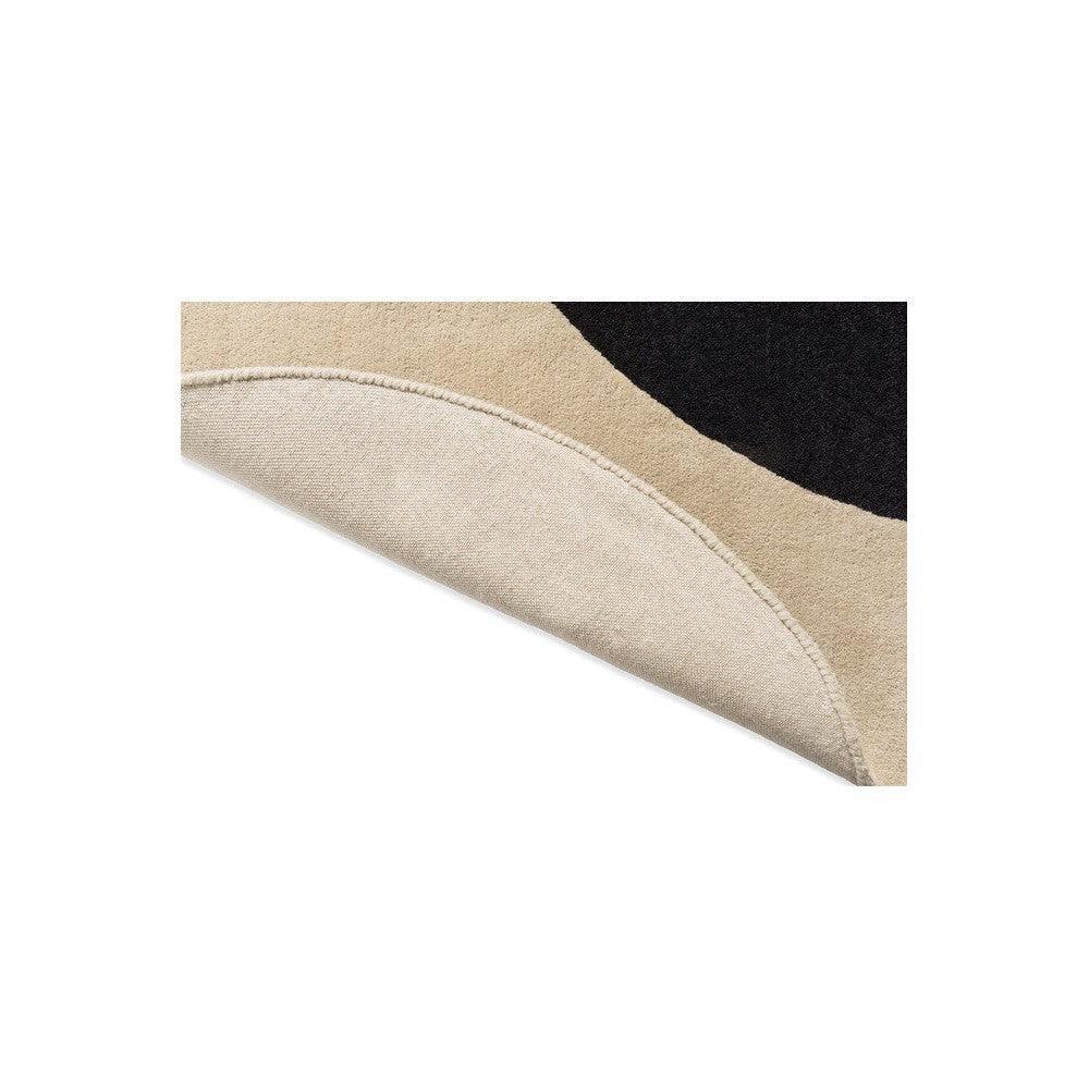 Orla Kiely Flower Spot rug featuring abstract circular motif in ecru, black on beige background, hand-tufted wool