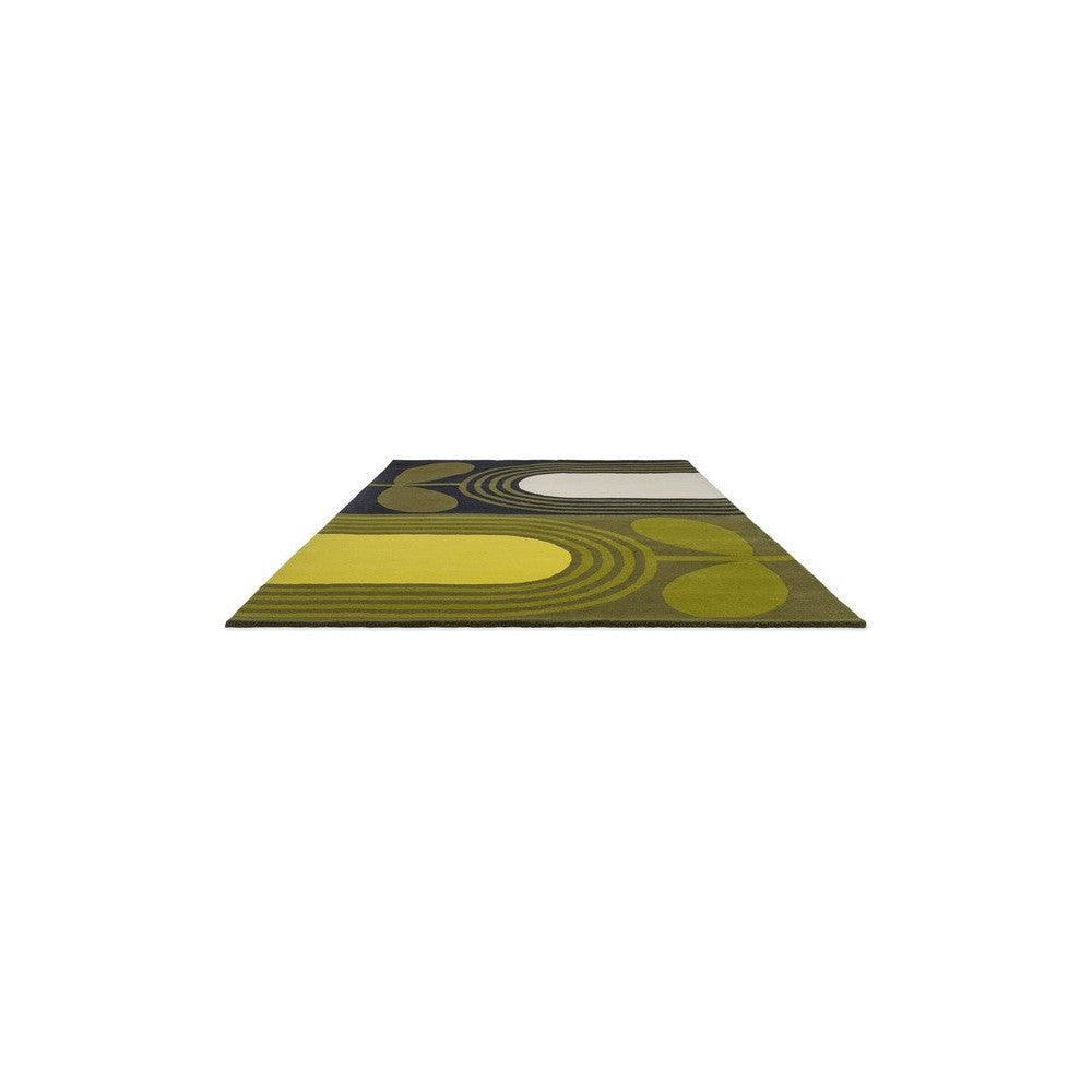 Orla Kiely Striped Tulip Seagrass Rug featuring circular geometric pattern in olive green, mustard yellow, charcoal on beige background, hand-tufted wool