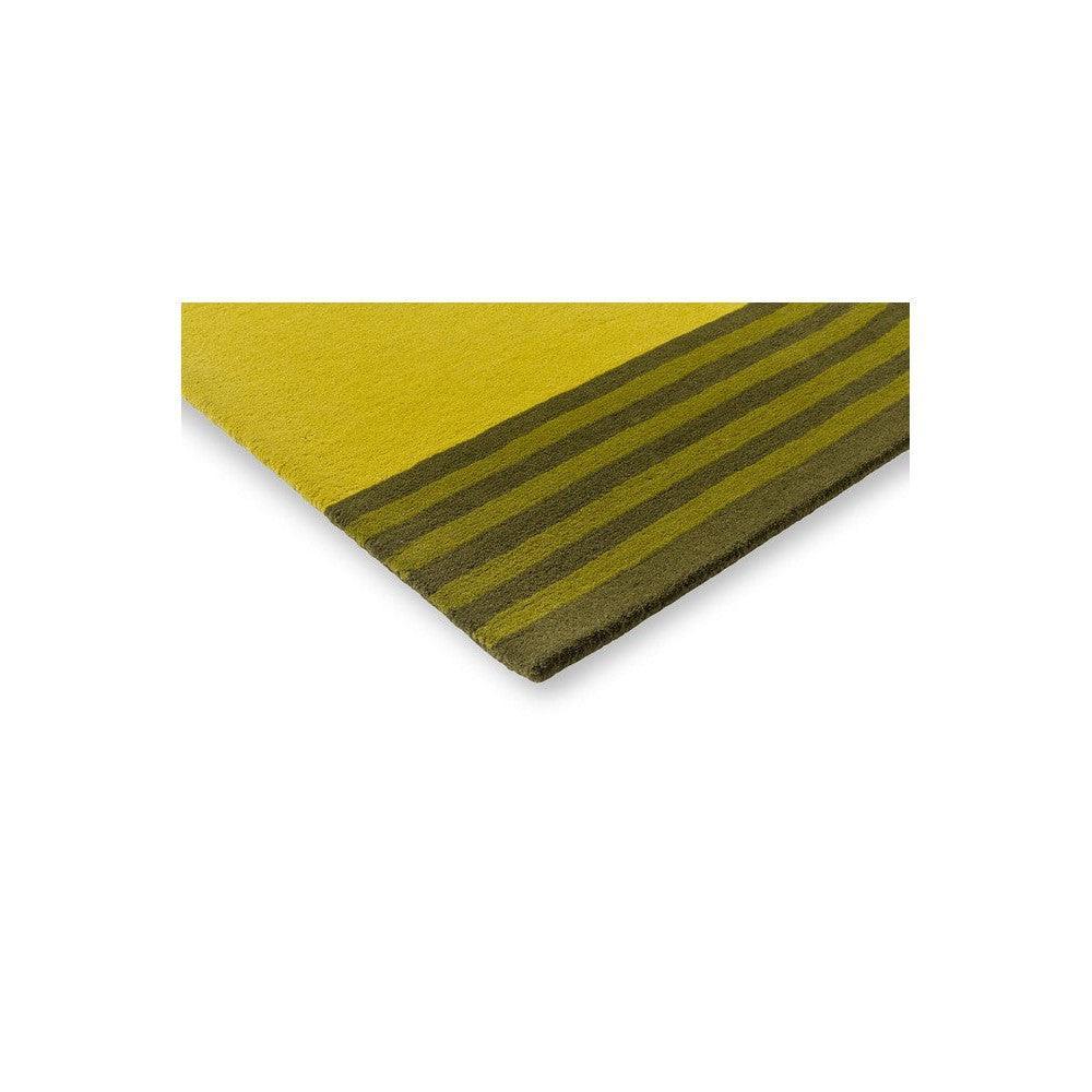 Orla Kiely Striped Tulip Seagrass Rug featuring olive green striped border on mustard yellow field, hand-tufted wool