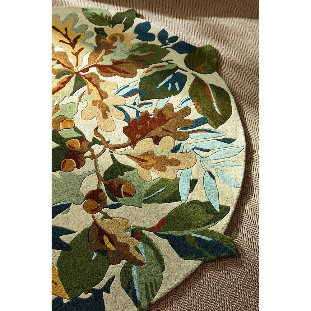 Sanderson Robin's Wood rug featuring botanical floral pattern in russet, olive, navy and cream on ivory background, hand-tufted wool