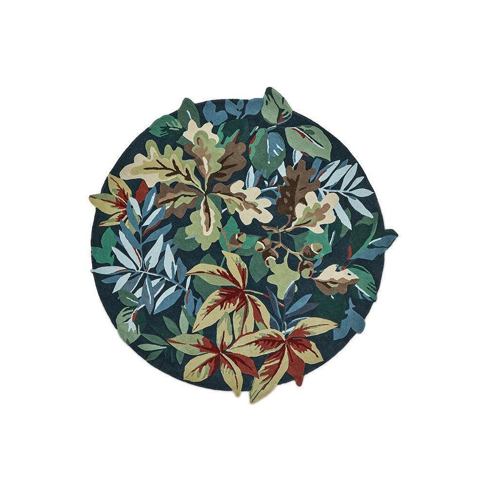Sanderson Robin's Wood Round Rug featuring botanical leaf pattern in forest greens, blues and burgundy on dark navy background