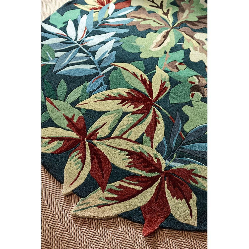 Sanderson Robin's Wood Forest Green Designer Rug featuring botanical leaf pattern in forest green, teal, cream, burgundy on dark teal background, hand-tufted wool