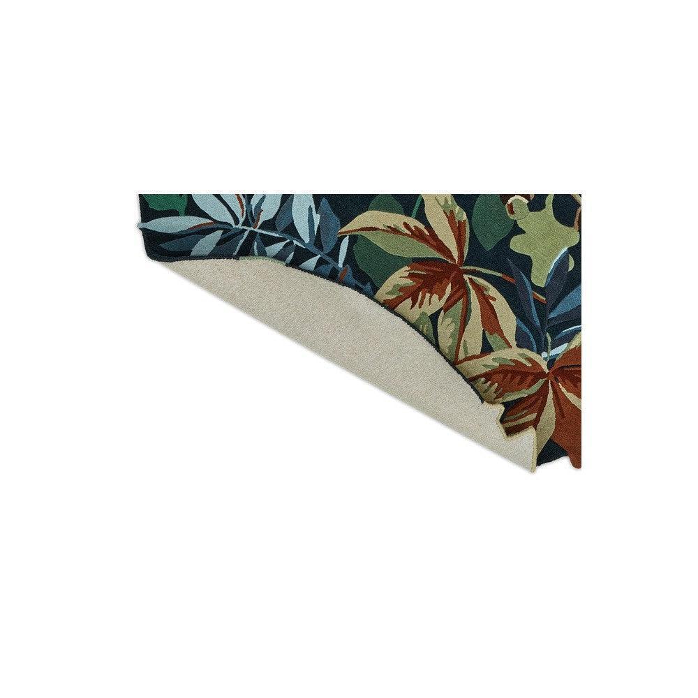 Sanderson Robin's Wood round rug featuring tropical foliage in forest green, emerald, teal, rust on dark background, hand-tufted wool