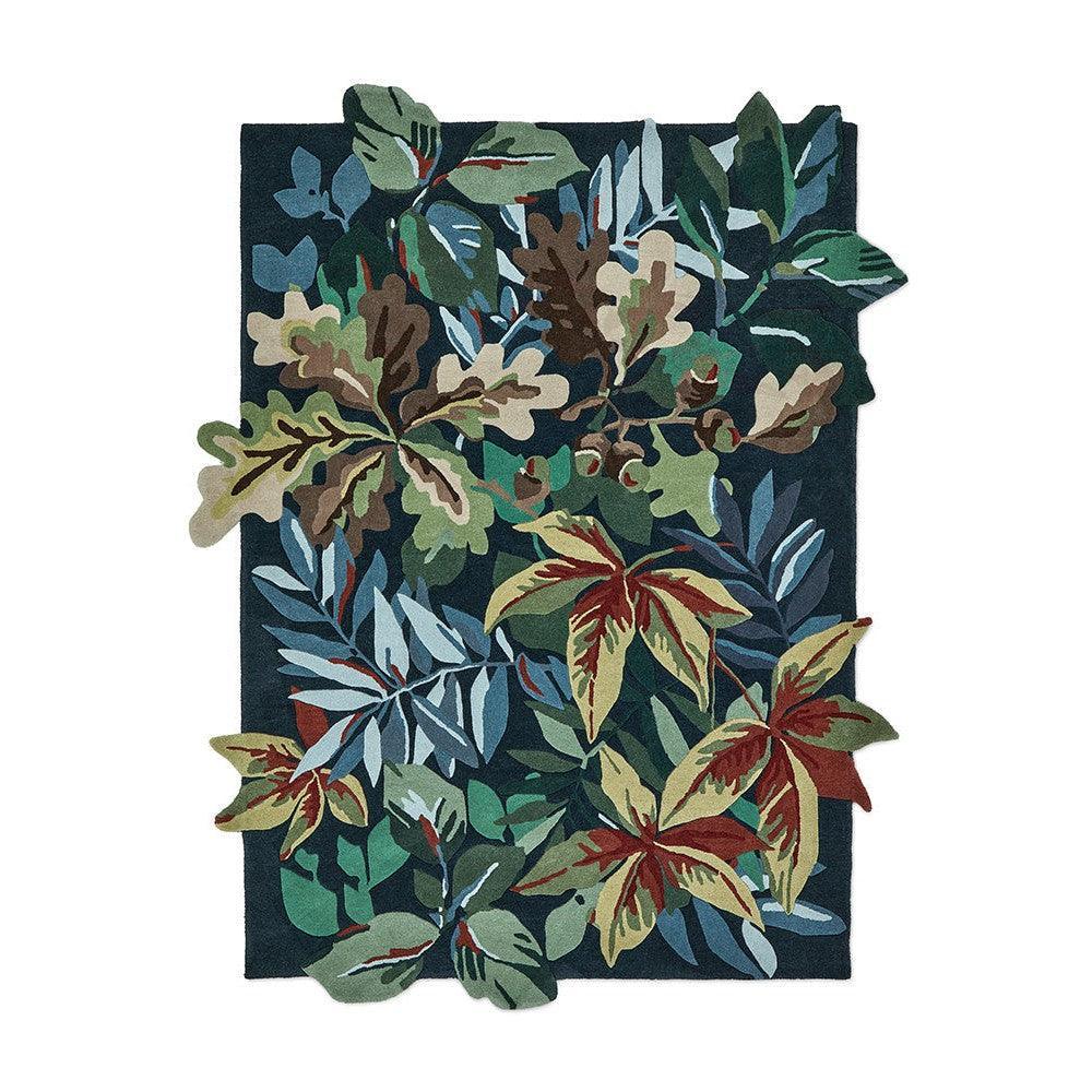 Sanderson Robin's Wood Designer Rug featuring botanical foliage in forest green, emerald, olive, burgundy, cream on dark navy, hand-tufted wool