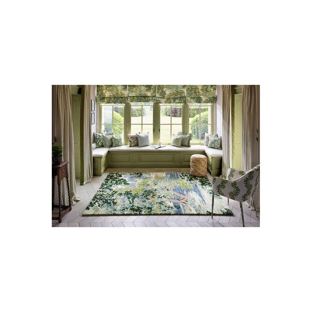 Sanderson Ancient Canopy Forest Green Rug featuring botanical canopy in forest green, sage, cream on pale beige background, hand-tufted wool