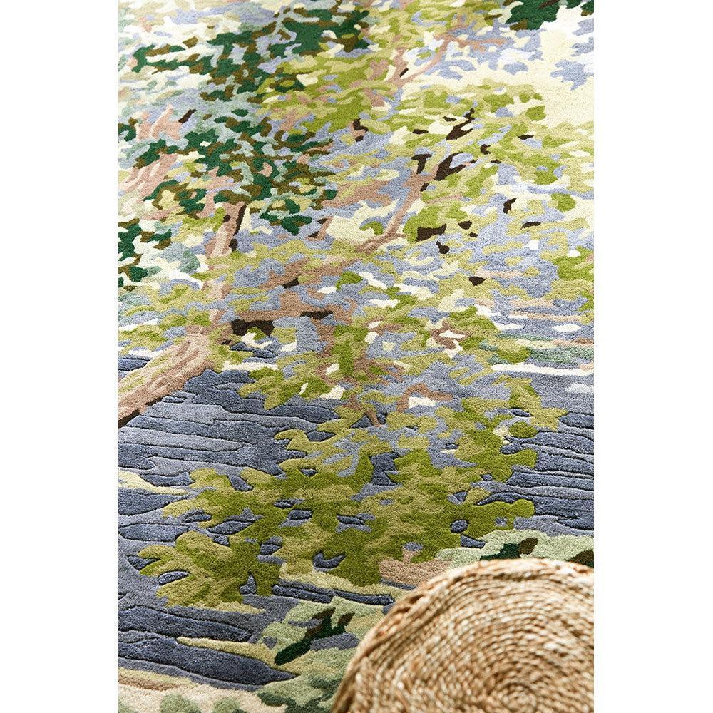 Sanderson Ancient Canopy Forest Green Rug featuring forest canopy pattern in emerald, sage, blue-grey and beige on cream background, hand-tufted wool