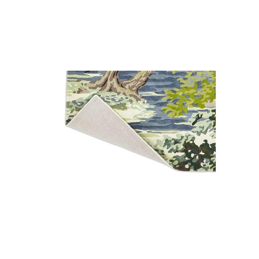 Sanderson Ancient Canopy Forest Green Rug featuring woodland landscape in forest green, olive, sage and navy on cream, hand-tufted wool