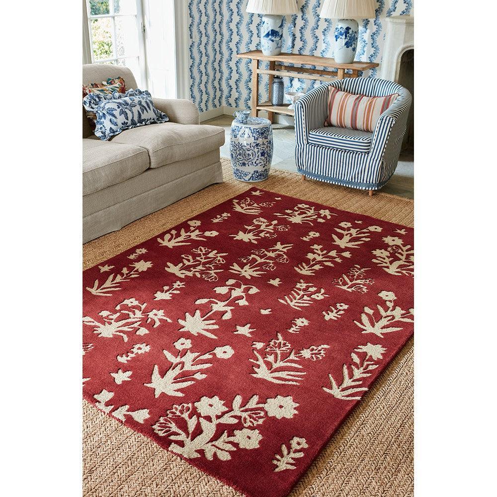 Sanderson Woodland Glade Damson Red Designer Rug featuring botanical floral pattern in cream on damson red background, woven wool