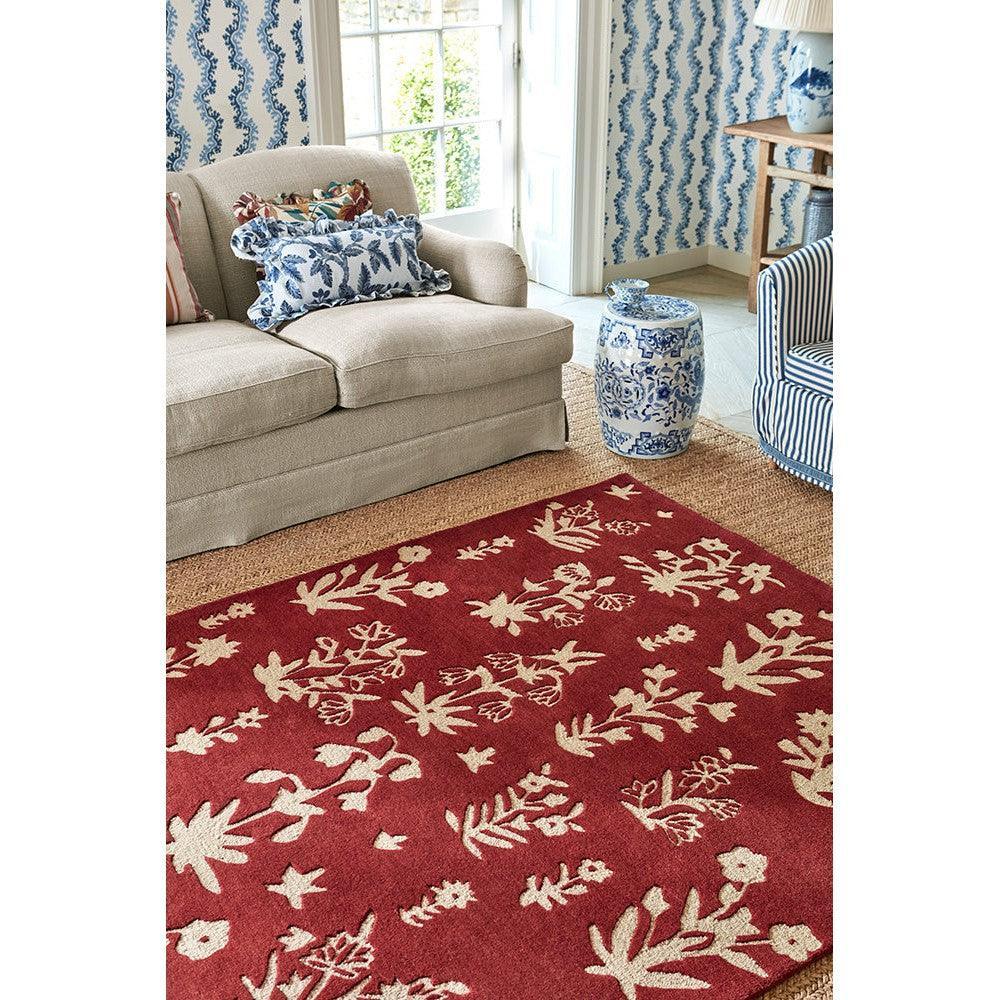 Sanderson Woodland Glade Damson Red Designer Rug featuring botanical floral pattern in cream on red background, hand-tufted wool