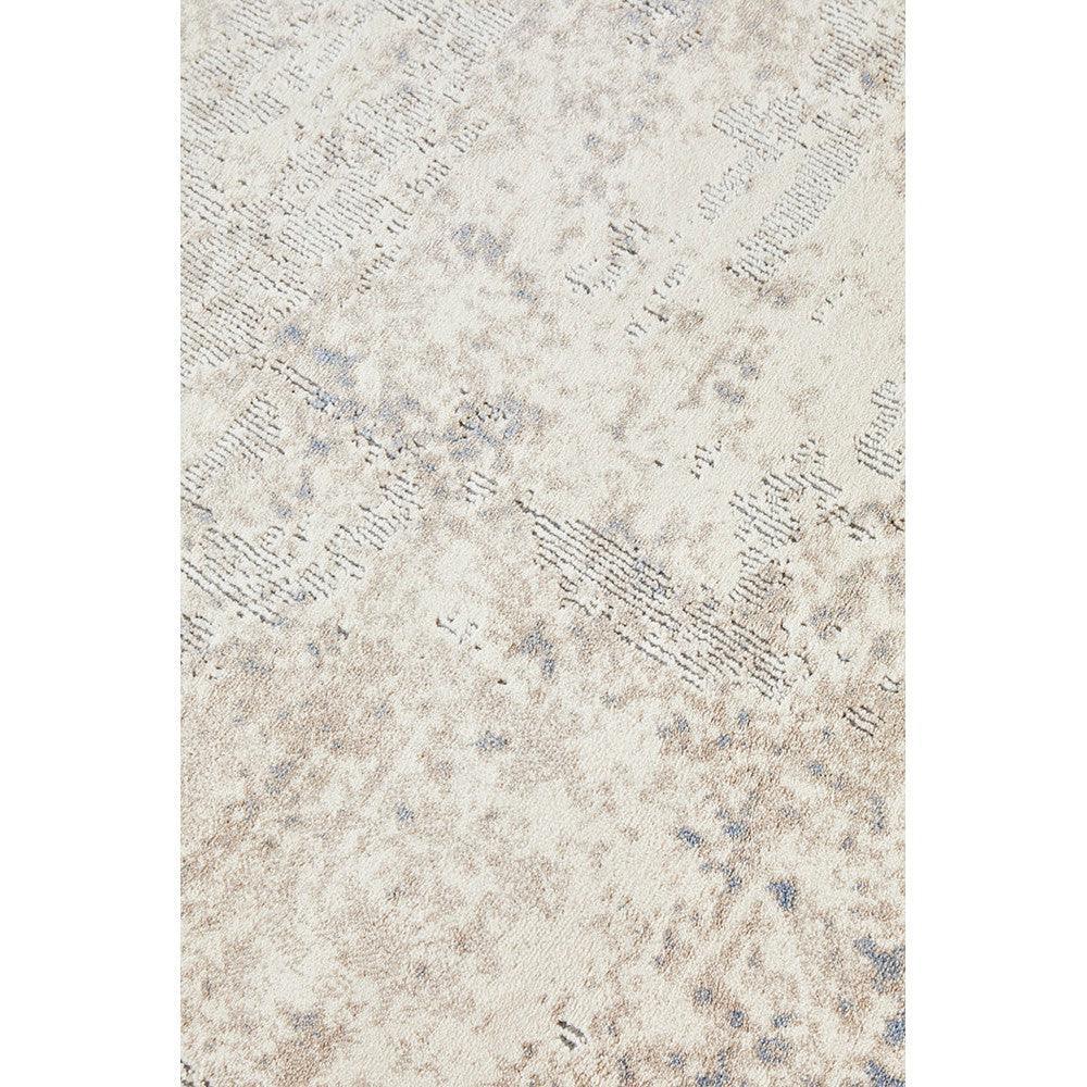 Bronte Aldo Sky Rug featuring distressed abstract pattern in ivory, beige and pale blue on cream background, machine-made polyester