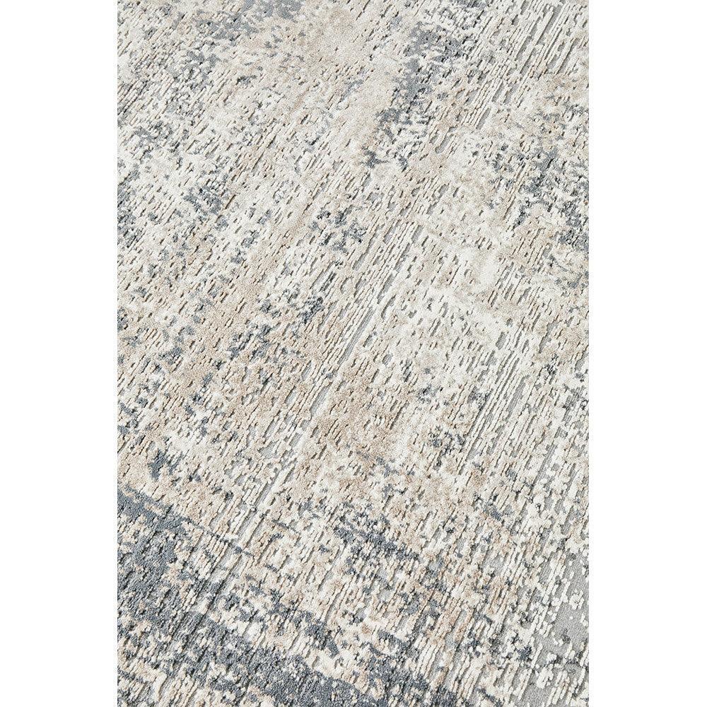 Bronte Ceasar Manor Rug featuring abstract distressed pattern in beige, taupe and grey on light cream background, hand-tufted wool