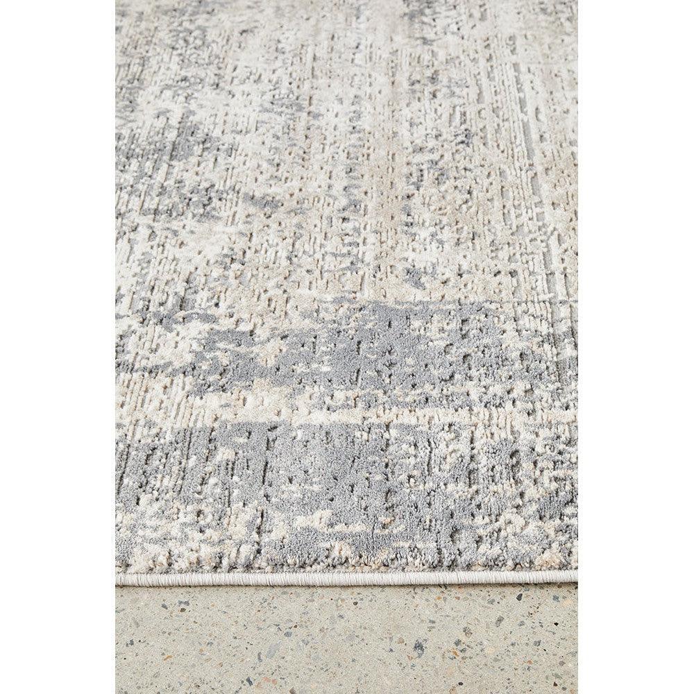 Bronte Ceasar Manor Rug featuring abstract distressed pattern in cream, light grey and pale blue on ivory background, hand-tufted wool