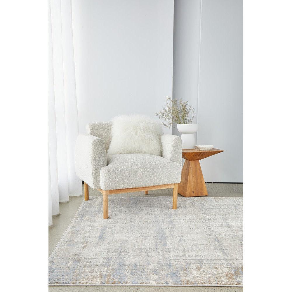 Bronte Nola Powder Rug featuring abstract distressed pattern in pale blue, ivory and taupe on cream background, hand-tufted wool