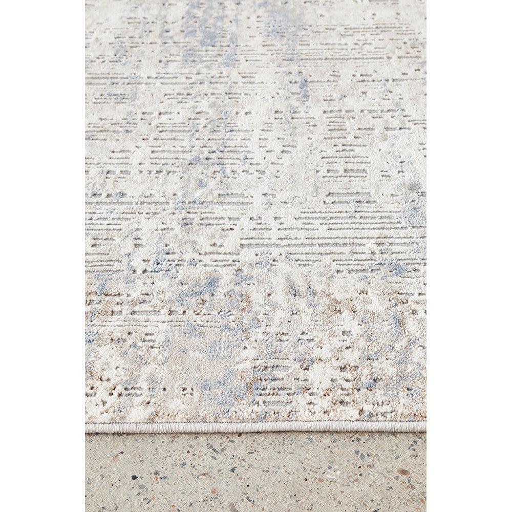 Bronte Nola Powder Rug featuring abstract distressed pattern in cream, beige and powder blue on light cream, hand-tufted wool