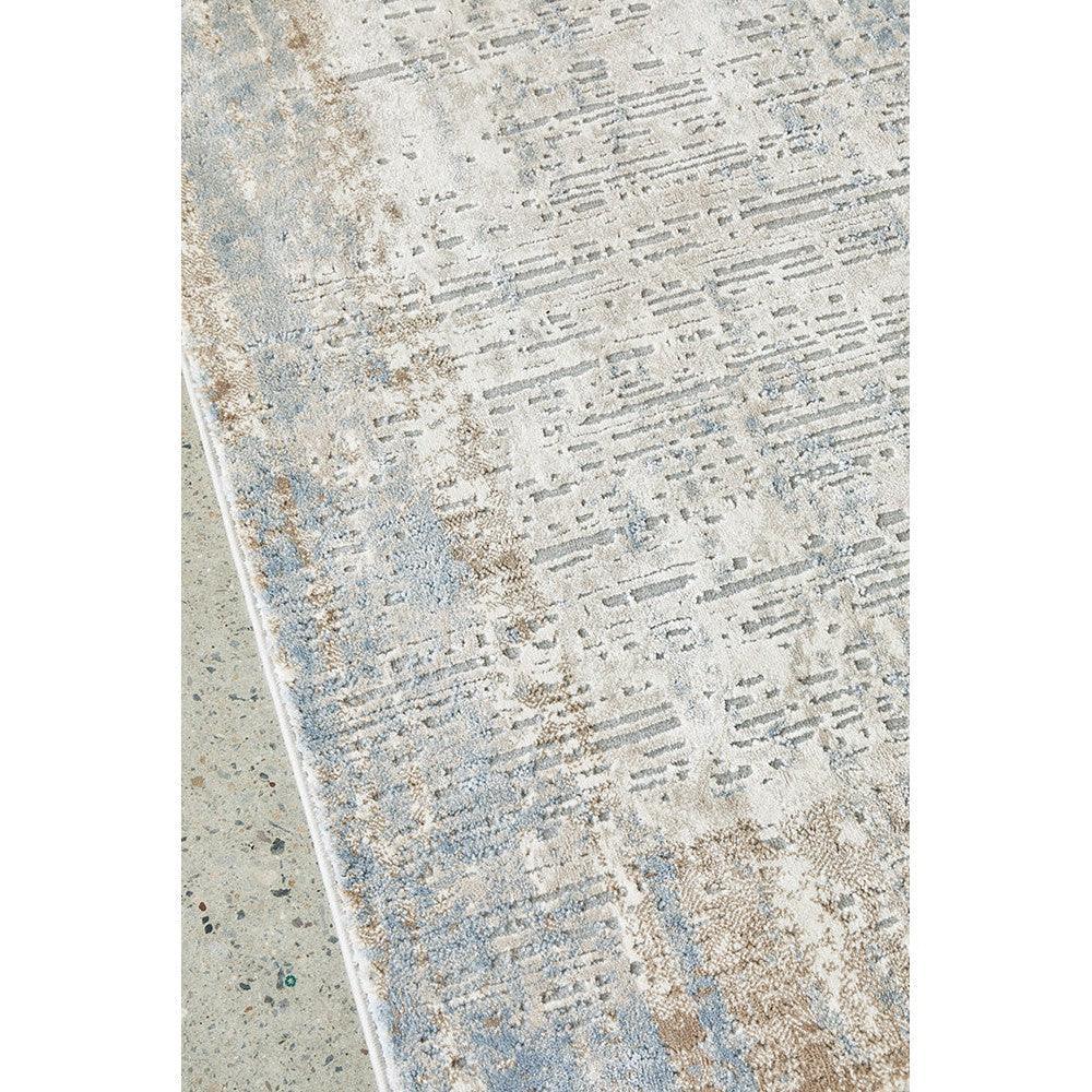 Bronte Nola Powder Rug featuring abstract distressed pattern in cream, powder blue, taupe on light beige background, hand-tufted wool