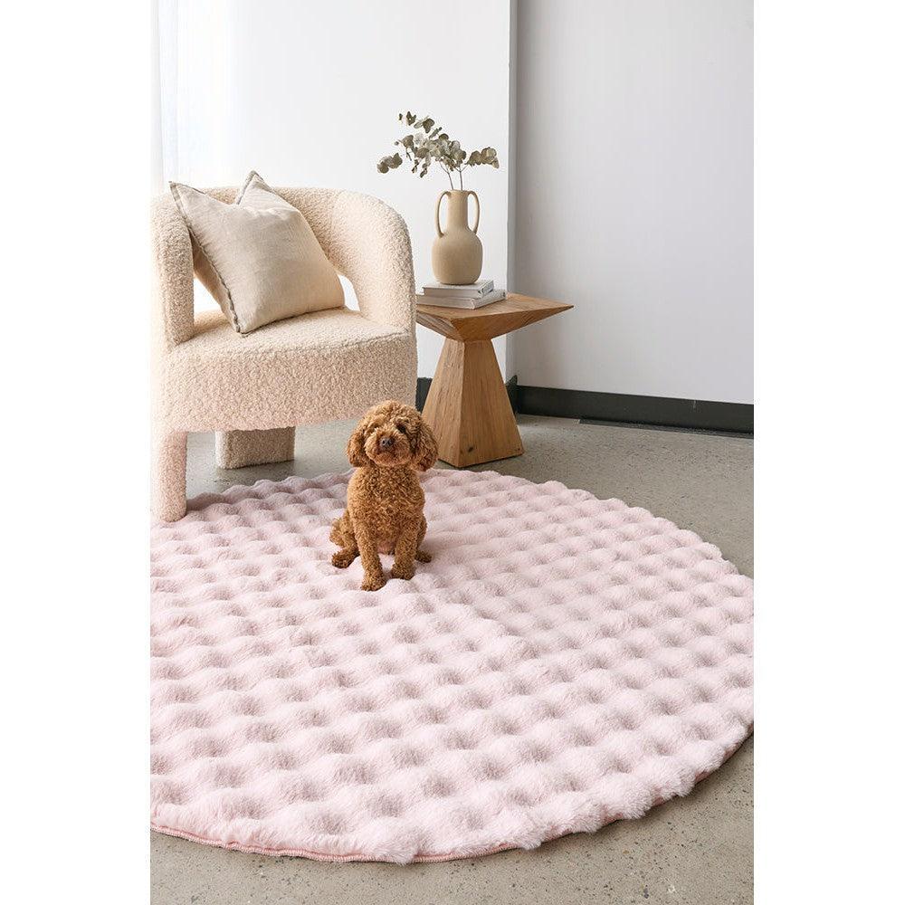 Bubble Blush Round rug featuring bubble texture in blush pink, cream on light grey floor, machine-washable polyester rug