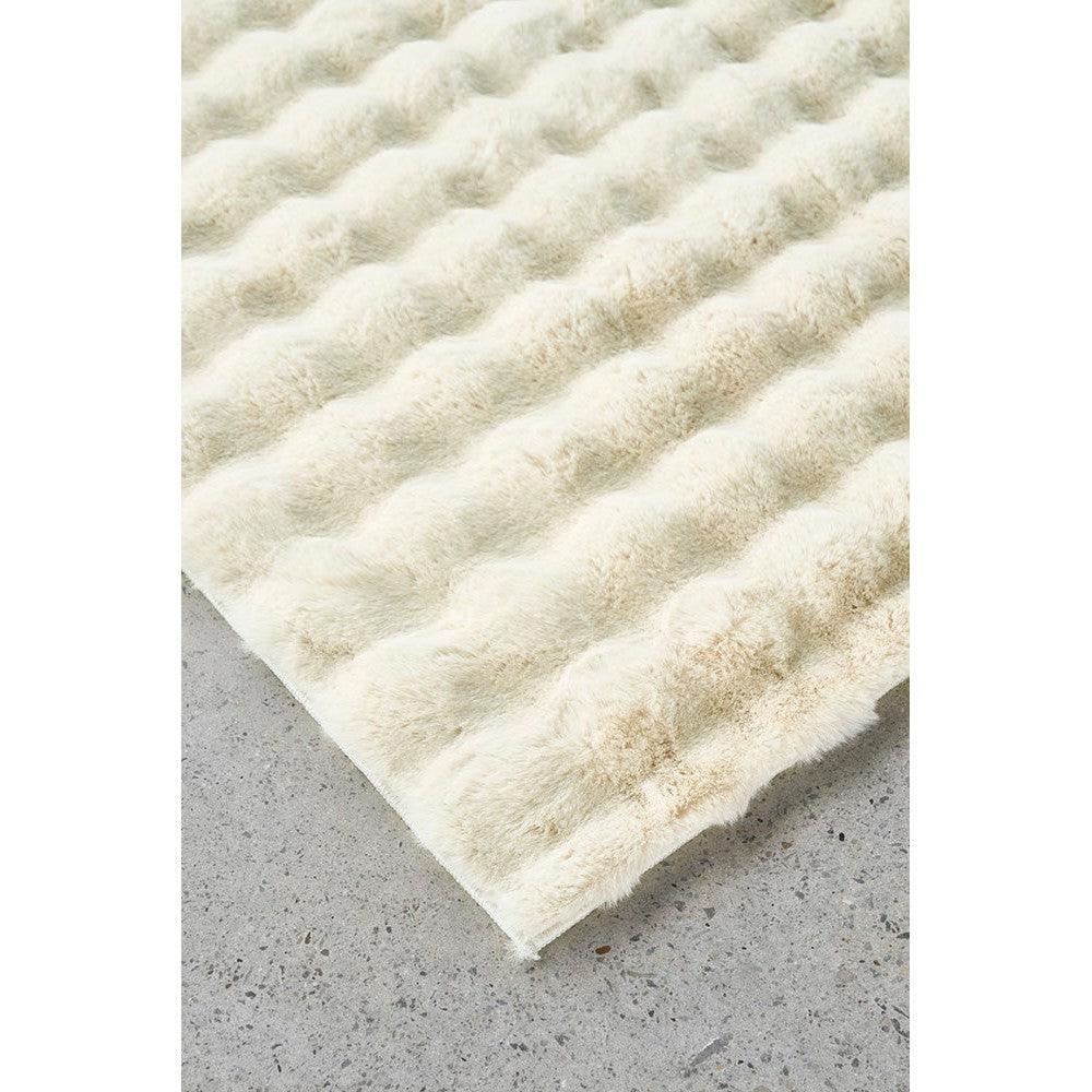 Bubble Natural rug featuring fluffy bubble texture in ivory, cream and beige on light grey floor, machine-washable rug