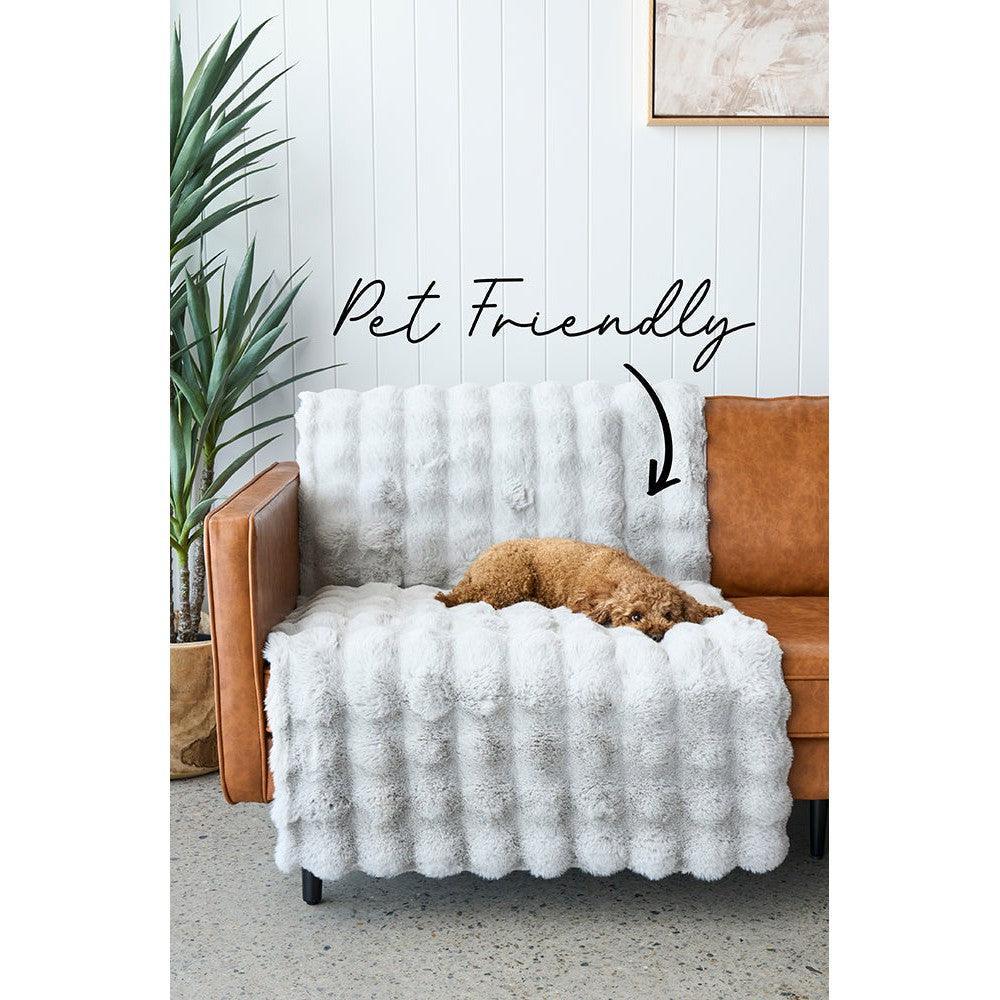 Bubble Silver - Machine Washable Rug featuring bubble tufted pattern in white/cream on pale blue wall backdrop, polyester