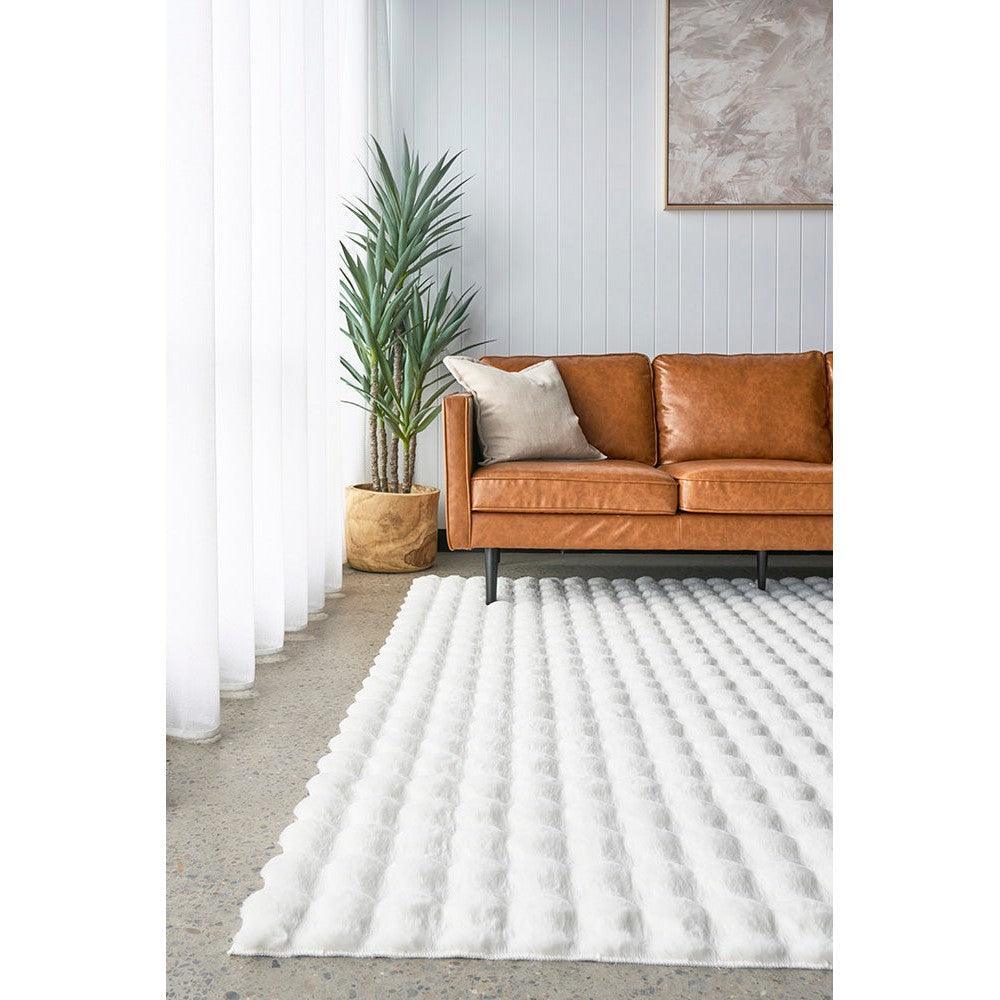 Bubble White - Machine Washable Rug featuring bubble pattern in white, tan-brown, emerald green and grey on light grey background, machine washable polyester