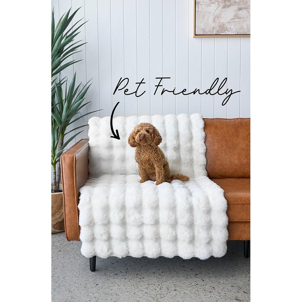 Bubble White machine-washable rug featuring plush bubble texture in white on brown sofa backdrop, Rug Culture