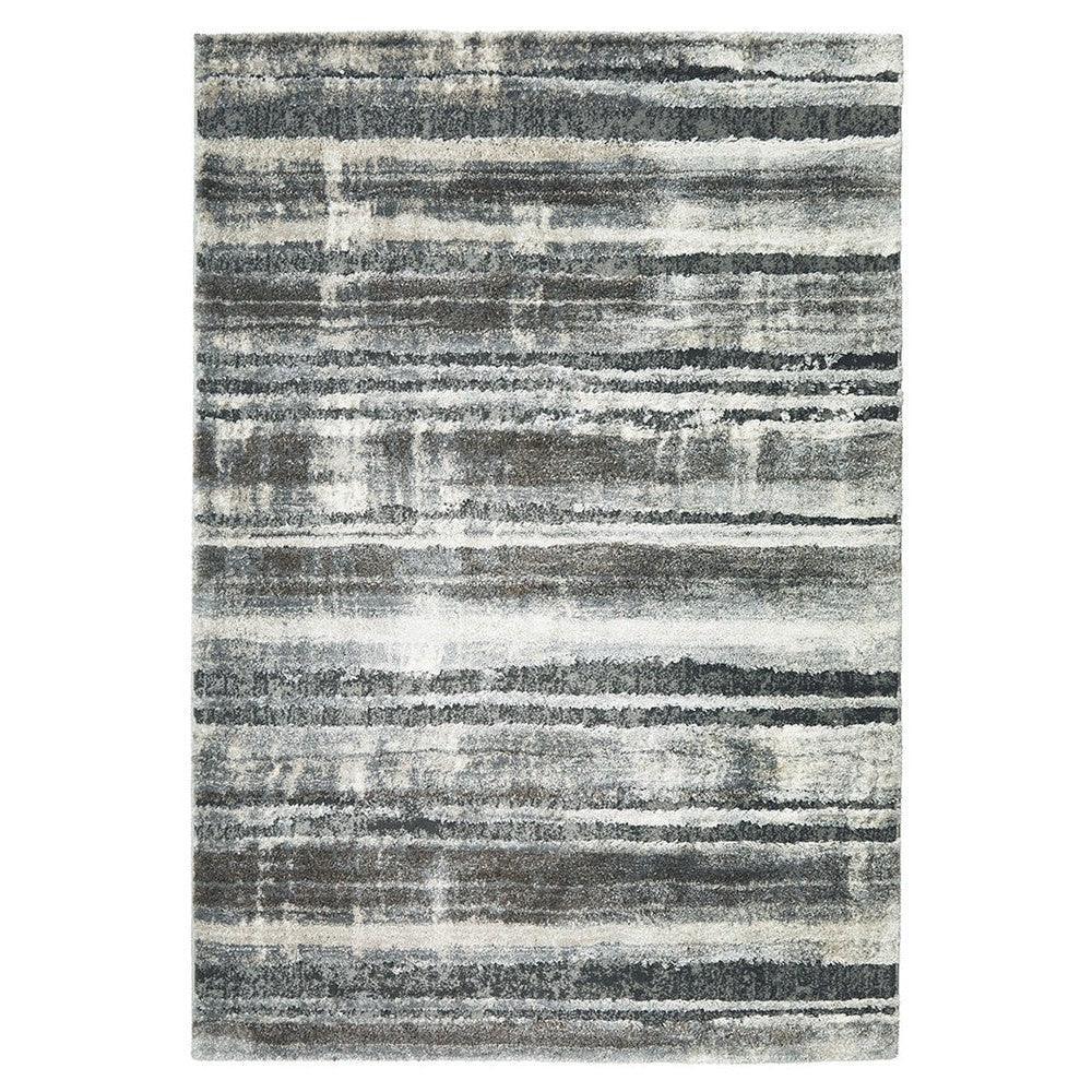 Himali Baley Slate Rug featuring abstract striped pattern in slate blue, charcoal, ivory on white, machine-woven polyester
