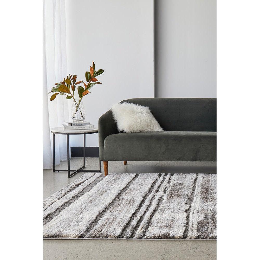Himali Baley Slate Rug featuring abstract striped pattern in ivory, cream and charcoal on slate background, machine-made wool