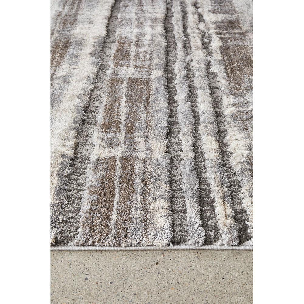 Himali Baley Slate Rug featuring vertical striped pattern in slate grey, taupe and ivory on light background, hand-tufted wool