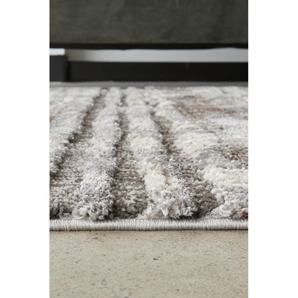 Himali Baley Slate Rug featuring striped shag pattern in slate grey, ivory and taupe on light grey base, hand-tufted wool