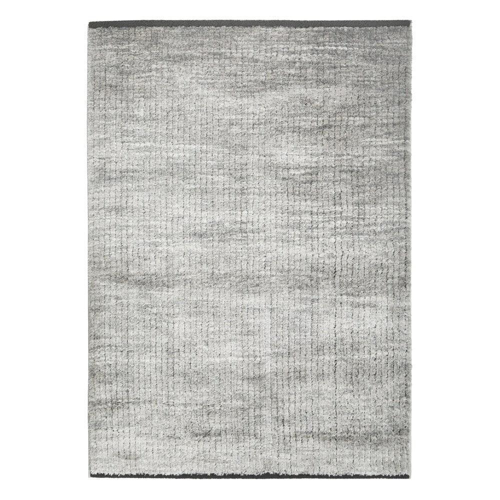 Himali Charlie Pewter Rug featuring subtle distressed texture in pewter and light grey on pale grey background, hand-tufted wool