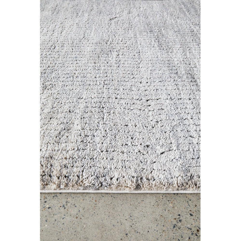 Himali Charlie Pewter Rug featuring shaggy textured design in pewter grey, light grey and cream on warm grey background, hand-tufted wool