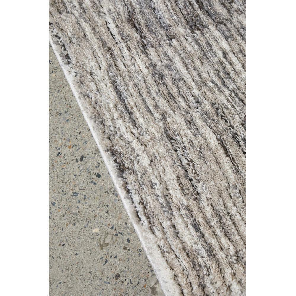 Himali Fin Rug featuring textured striped pattern in steel, ivory and taupe on light grey background, hand-tufted wool