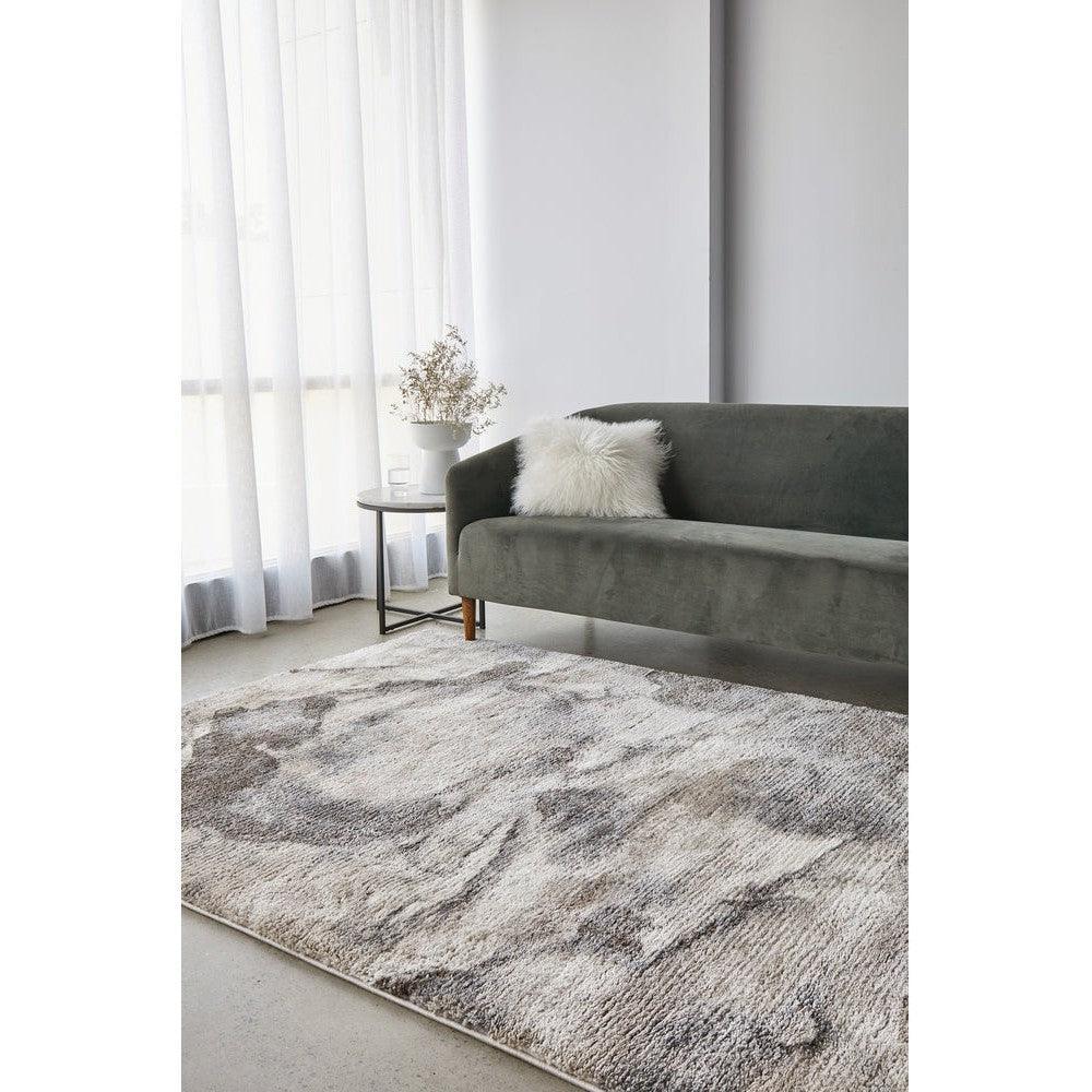 Himali Pedro Storm Rug featuring abstract tonal pattern in charcoal grey, dove grey, ivory on light grey background, hand-tufted wool
