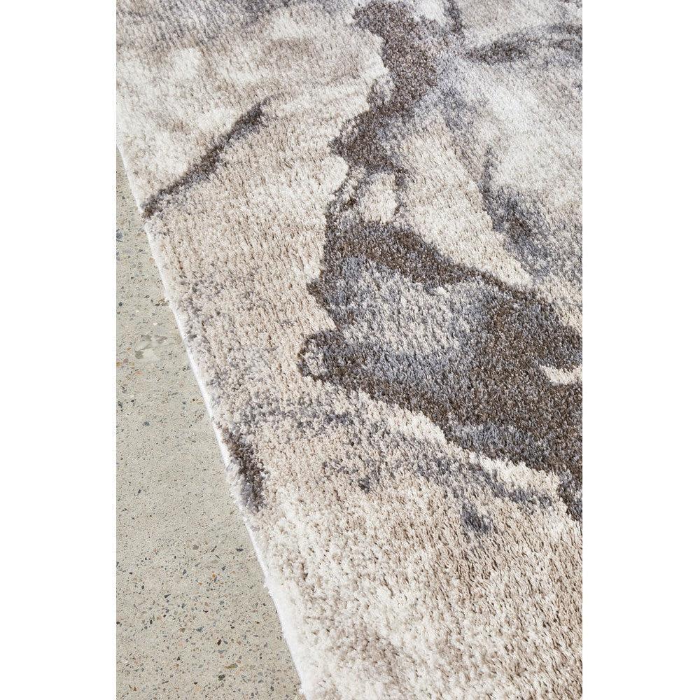 Himali Pedro Storm Rug featuring abstract marbled pattern in cream, beige, taupe and brown on light background, hand-tufted wool