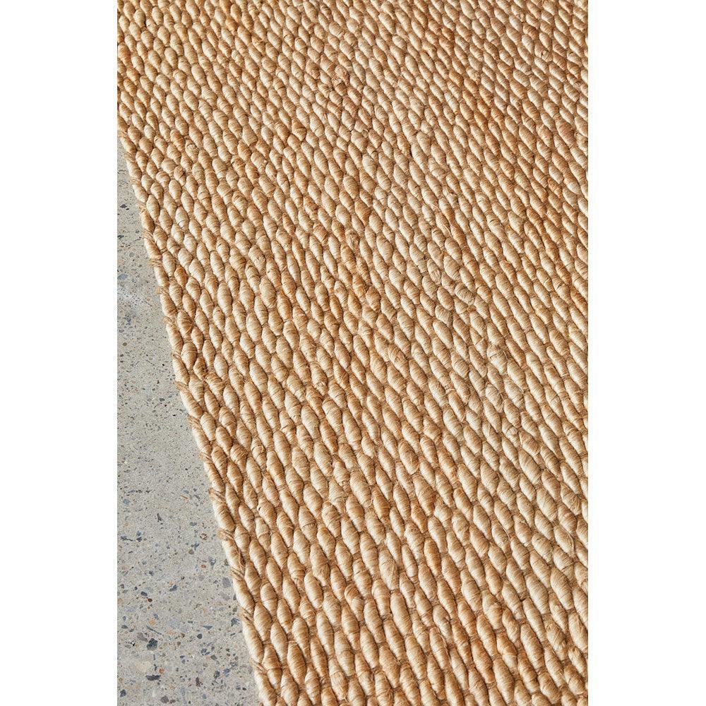 Hive Natural Rug featuring braided rope texture in beige and tan on natural jute background, hand-woven rug