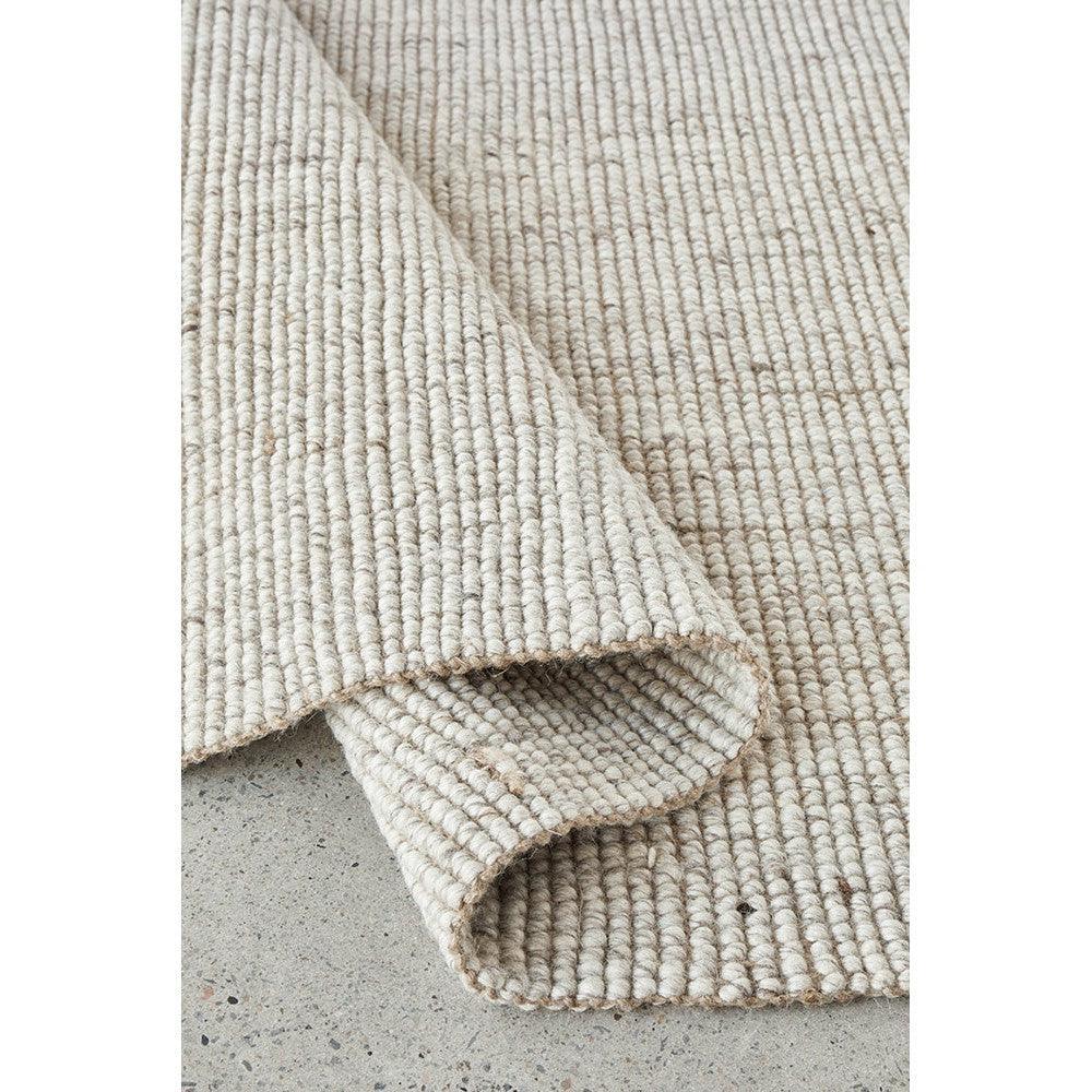 Harlow Ariel Beige Rug featuring ribbed looped texture in cream and beige on light grey background, woven fabric