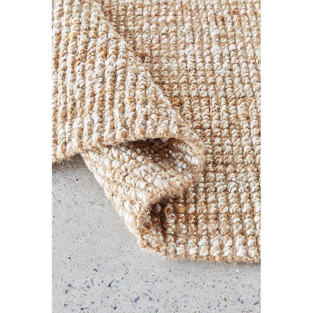 Harlow Hunter Natural Rug featuring textured looped weave in beige, tan and cream on light grey background, hand-woven jute