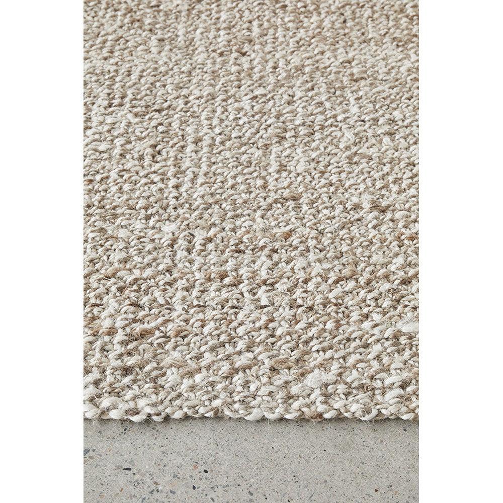 Harlow Parker Silver Rug featuring textured boucle in cream, beige and taupe on light grey background, handwoven wool
