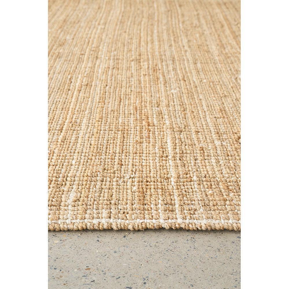 Madras Marlo Natural Runner Rug featuring striped textured pattern in natural beige and cream on concrete background, hand-woven jute