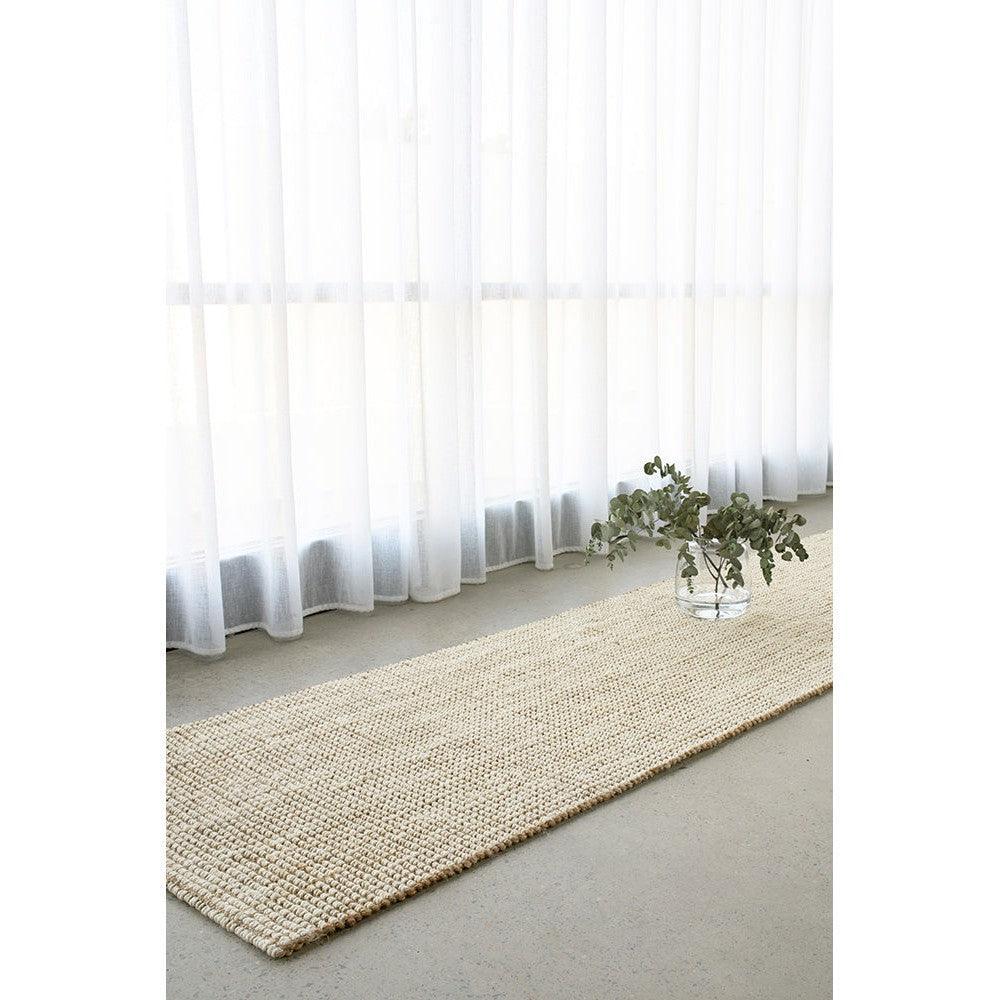 Madras Marlo White Jute Runner Rug featuring plain woven texture in natural beige and cream on light grey floor, handwoven jute