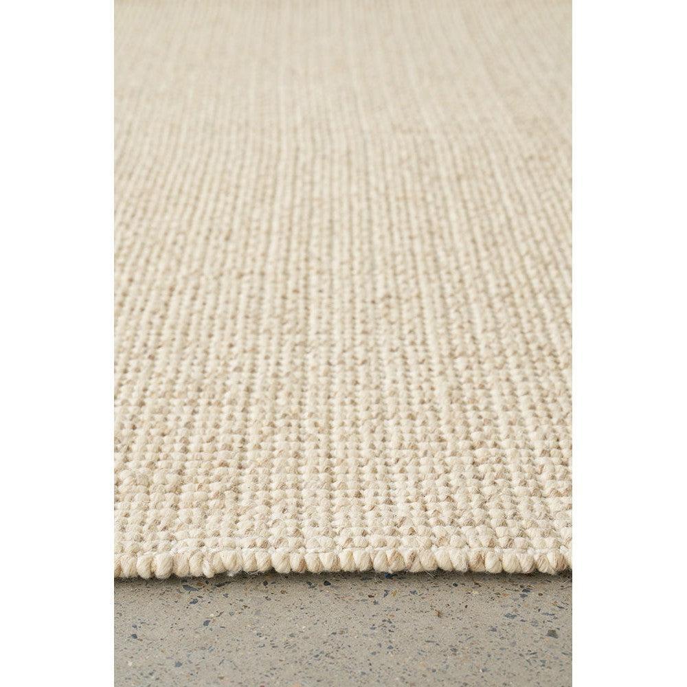 Madras Parker Cream Wool & Jute Rug with textured plain-weave in cream/beige on light concrete floor, handwoven wool & jute