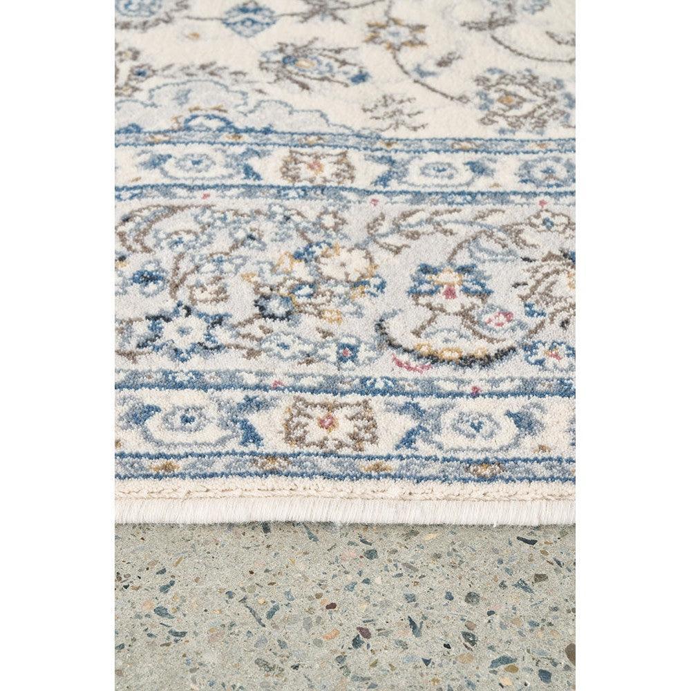 Melody Kashan Ivory Wool Rug featuring floral Kashan pattern in ivory, navy blue, sky blue and taupe on ivory background, hand-knotted wool