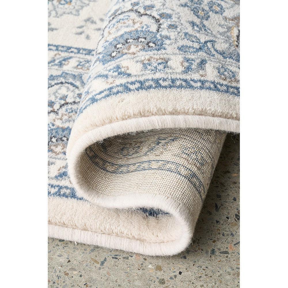 Melody Nain Cream Wool Rug featuring Persian floral motif in ivory, light blue and navy on cream background, hand-tufted wool